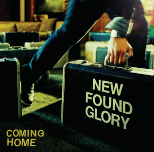 A photo of lead vocalist Jordan Pundik walking out of a restaurant holding a suitcase that reads the words 'NEW FOUND GLORY'. The words 'COMING HOME' appear in the bottom-left of the image.