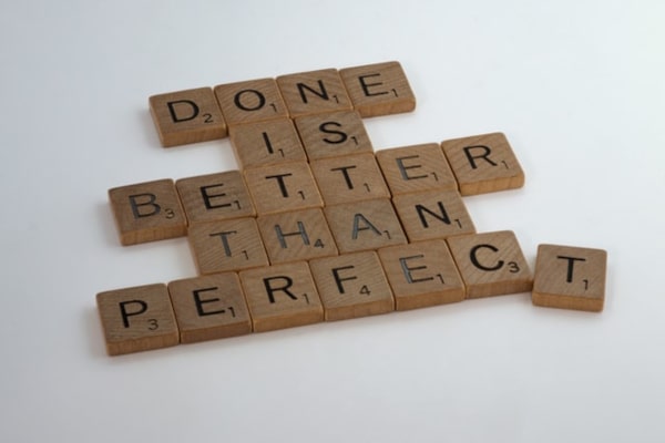 Scrabble pieces with the text 'Done is better than perfect'